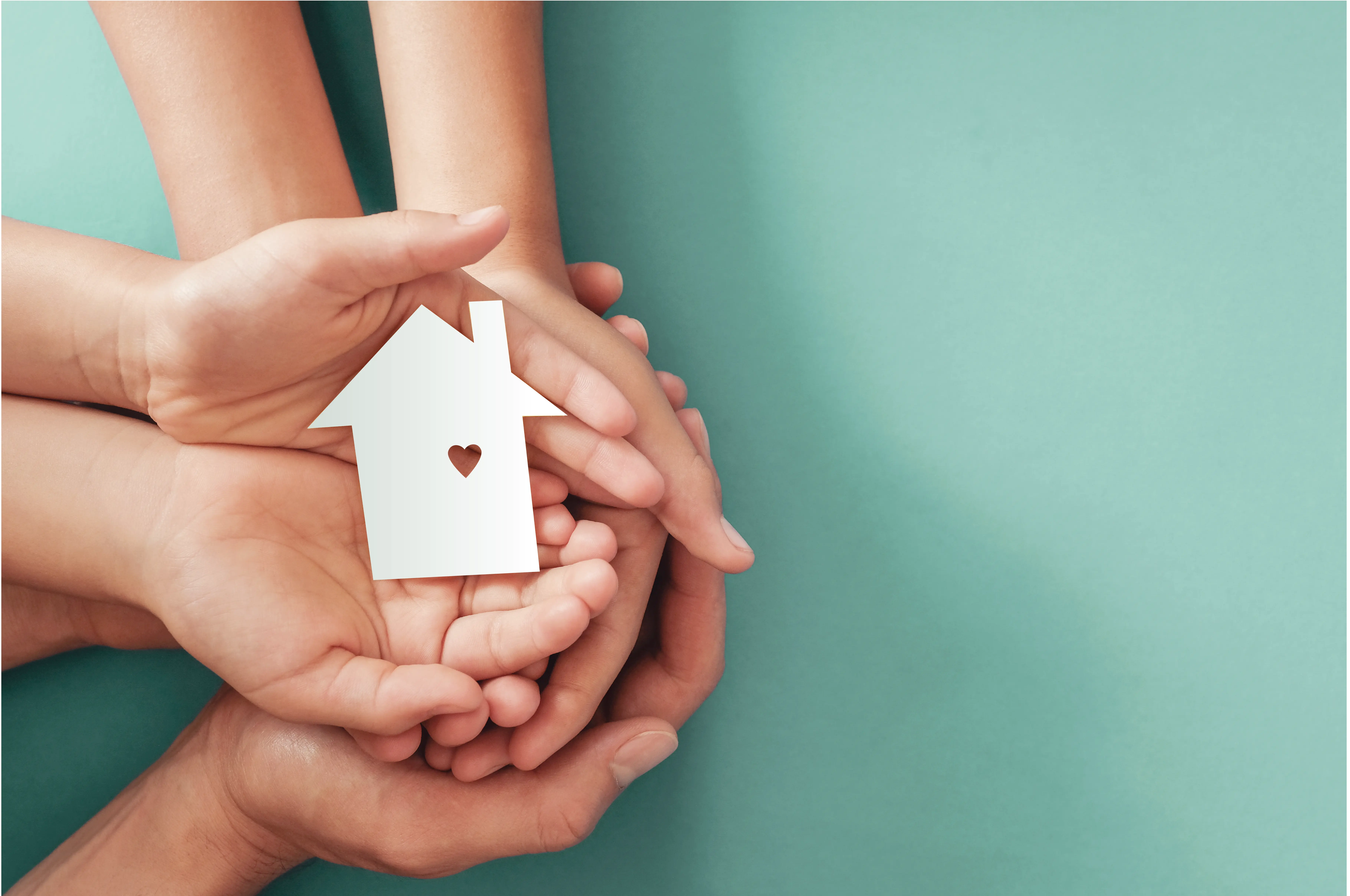 HP Homecare - Exceptional bespoke care with hands holding a house with heart, representing our commitment to providing premium private care at home in London